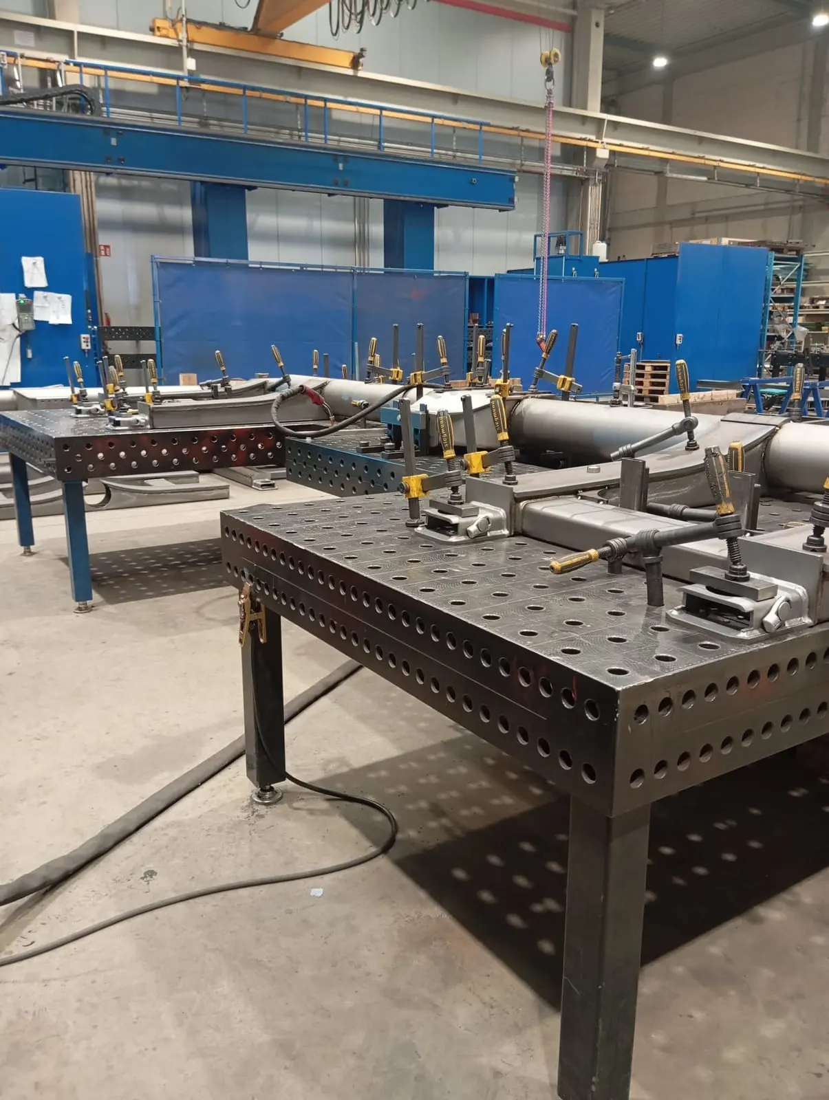 Welding and fixture tables in Froler's metalwork workshop