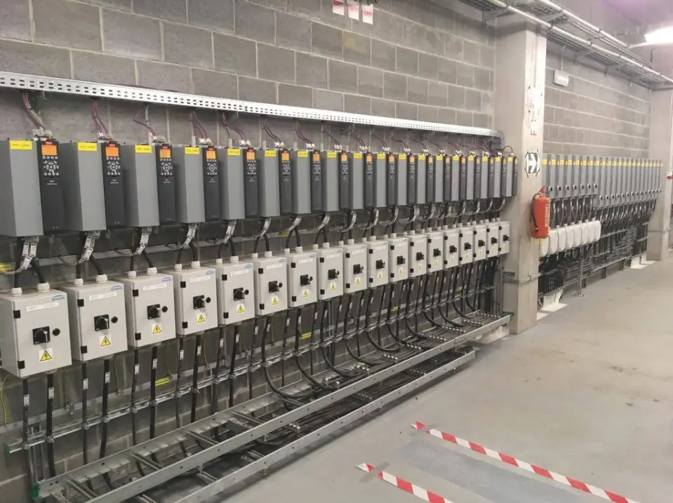 Row of frequency converters in a control cabinet